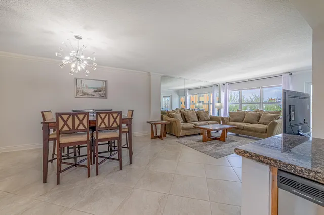 a living room with furniture and a gym equipment