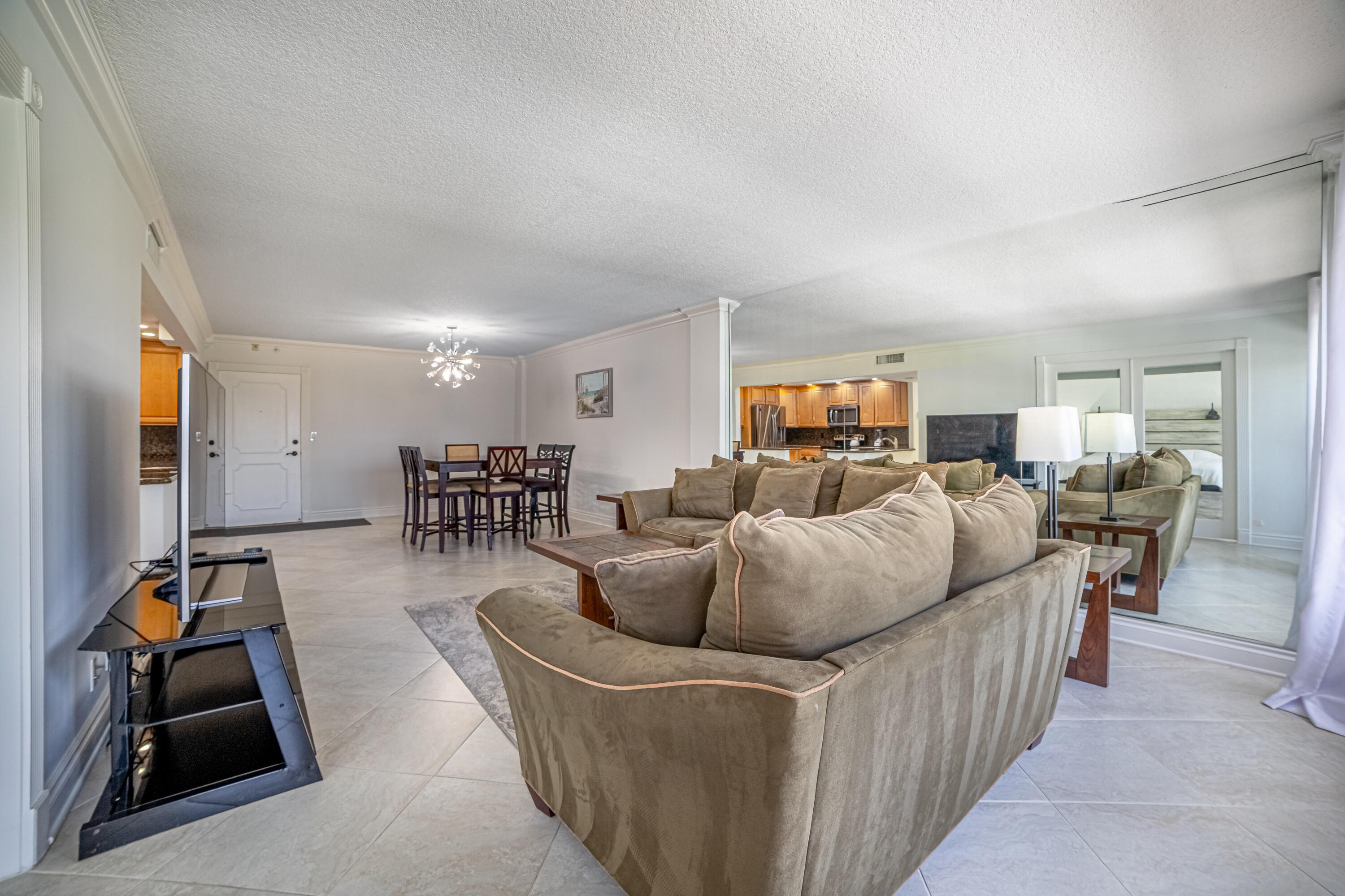 405 North Ocean Boulevard, Unit 507 Pompano Beach, FL 33062 - Photo 13 of 38 a living room with furniture and a gym equipment