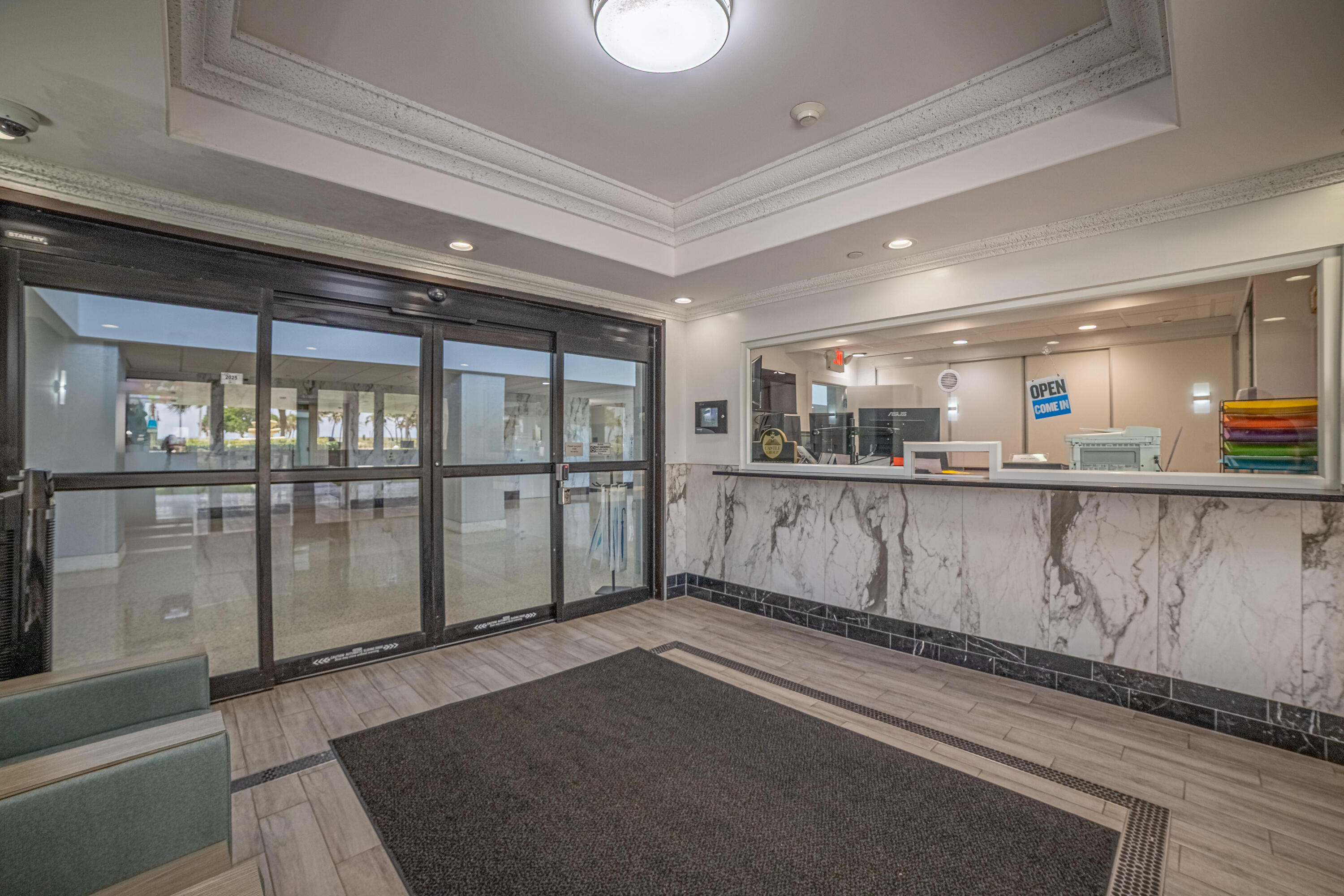 405 North Ocean Boulevard, Unit 507 Pompano Beach, FL 33062 - Photo 23 of 38 a view of kitchen with granite countertop lots of wooden cabinets