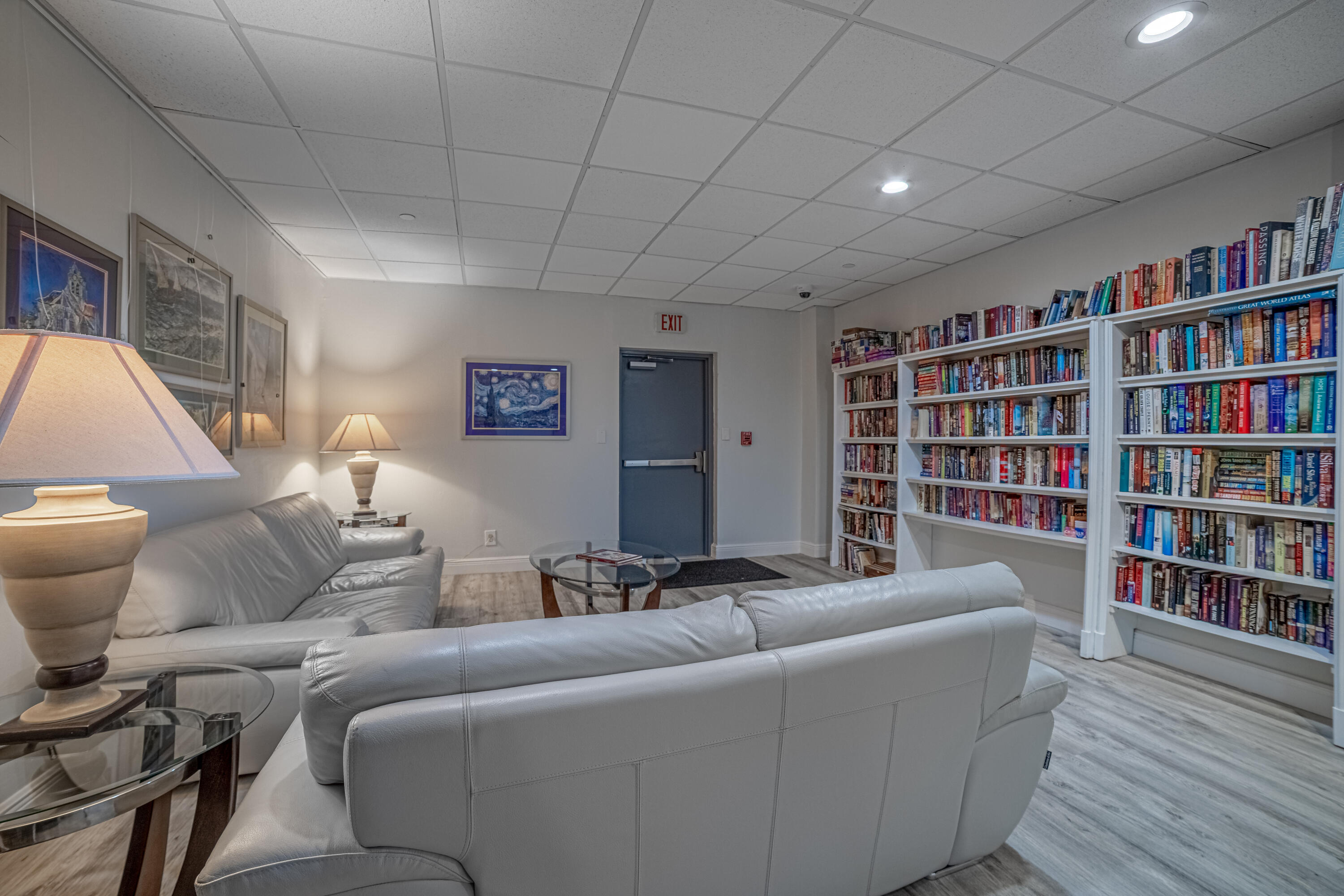 405 North Ocean Boulevard, Unit 507 Pompano Beach, FL 33062 - Photo 24 of 38 a living room with furniture and a book shelf