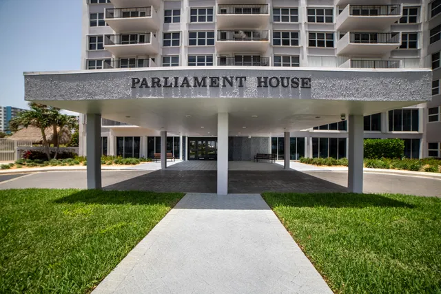 a view of a building with a yard