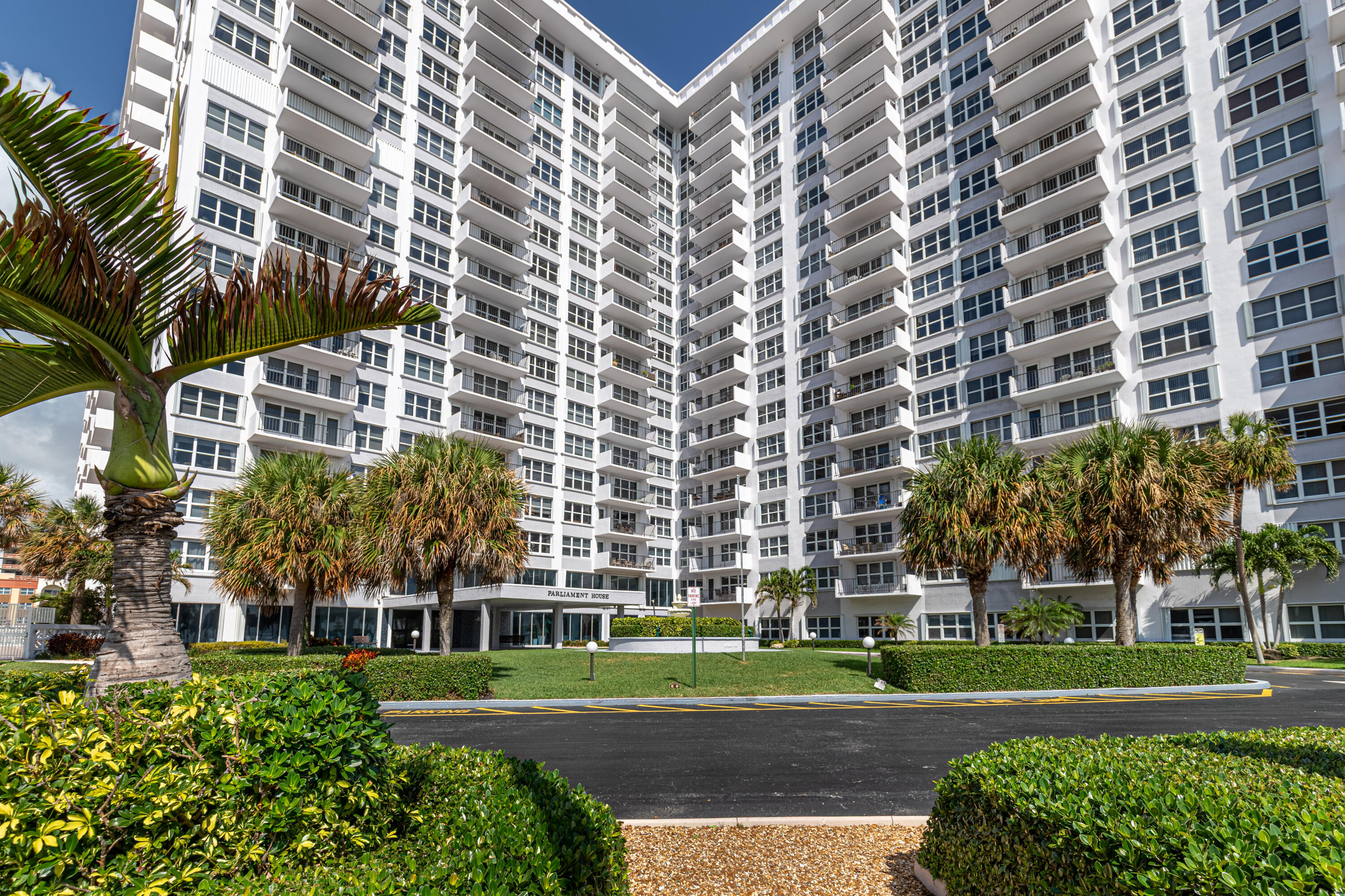 405 North Ocean Boulevard, Unit 507 Pompano Beach, FL 33062 - Photo 36 of 38 a view of a building with a yard