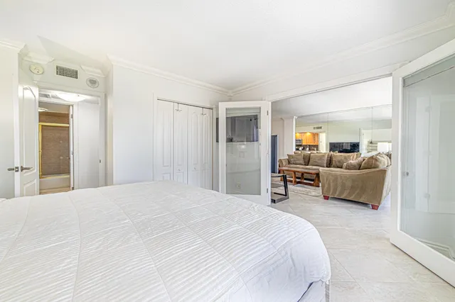 a bathroom with a granite countertop sink toilet a mirror and shower
