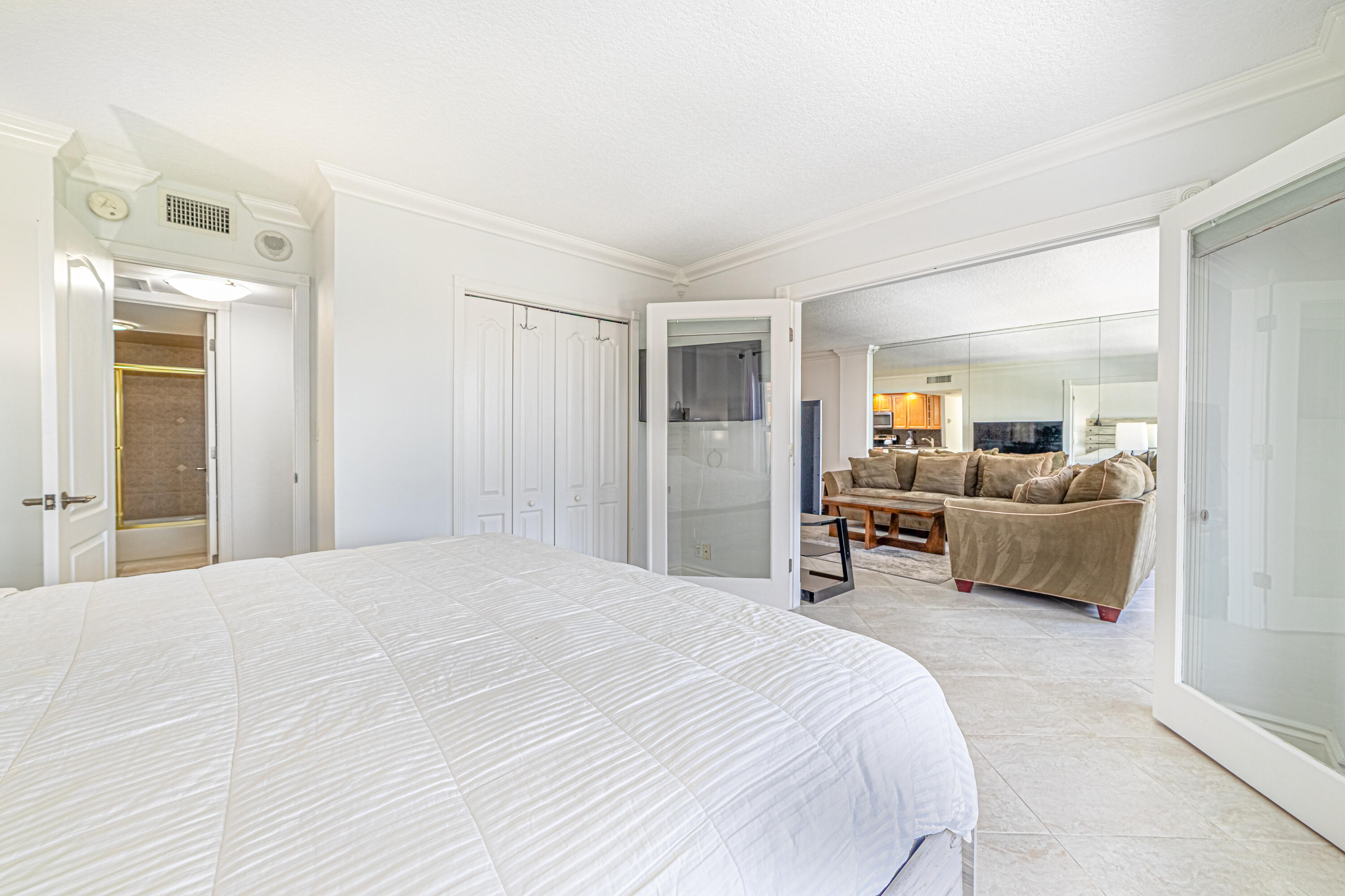 405 North Ocean Boulevard, Unit 507 Pompano Beach, FL 33062 - Photo 5 of 38 a bedroom with a bed and furniture