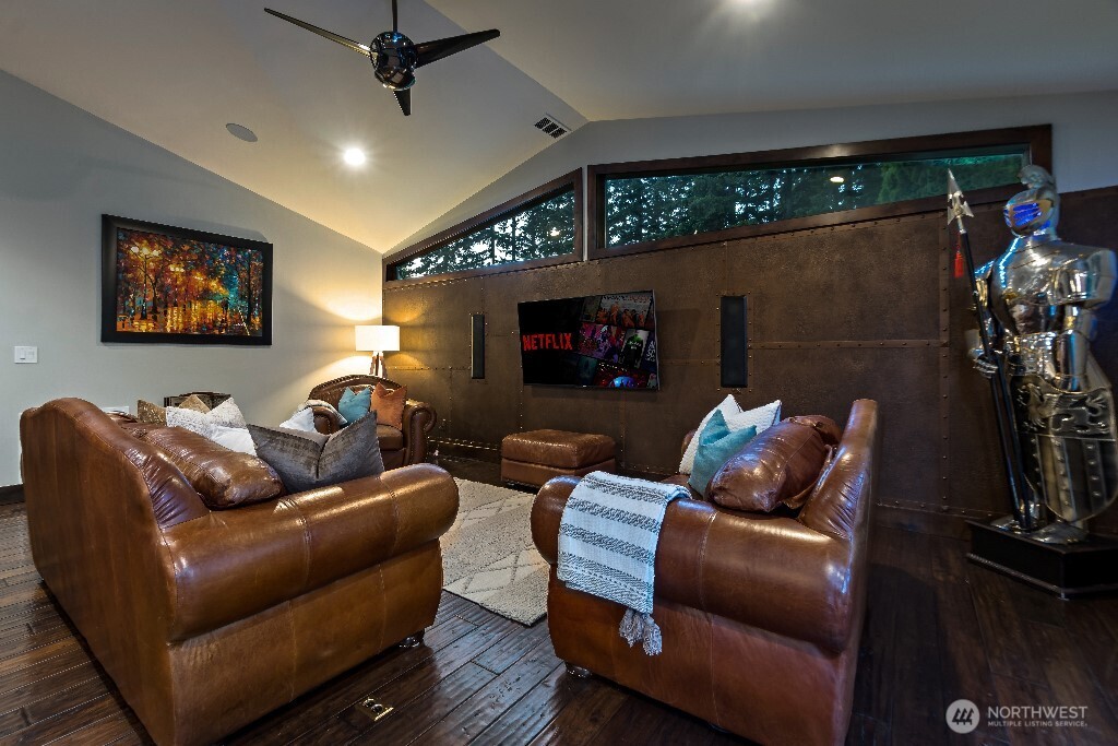 21713 45th Avenue Southeast Bothell, WA 98021 - Photo 16 of 40 a living room with furniture a fireplace and a flat screen tv