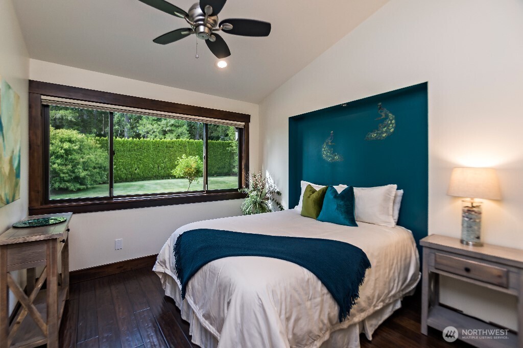 21713 45th Avenue Southeast Bothell, WA 98021 - Photo 18 of 40 a bed sitting in a bedroom next to a window