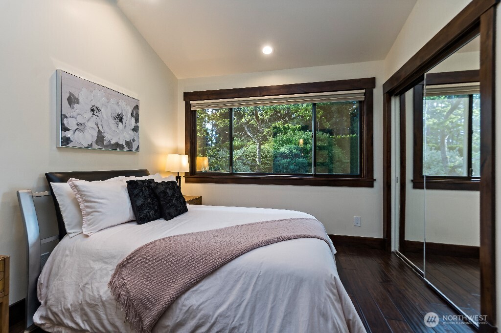 21713 45th Avenue Southeast Bothell, WA 98021 - Photo 19 of 40 a bed sitting in a bedroom next to a large window