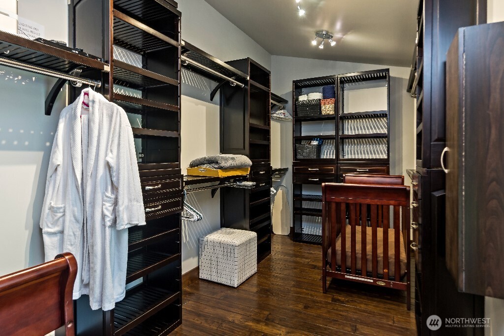 21713 45th Avenue Southeast Bothell, WA 98021 - Photo 21 of 40 a view of walk in closet with clothes and shoes
