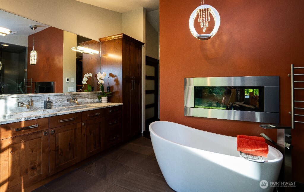21713 45th Avenue Southeast Bothell, WA 98021 - Photo 23 of 40 a bathroom with a tub and a sink