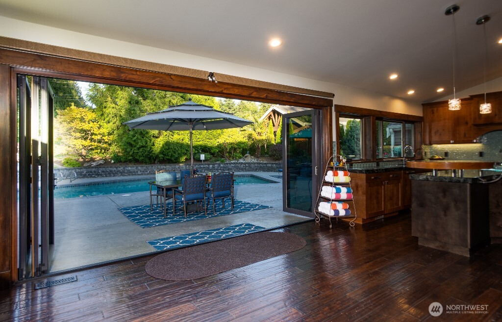 21713 45th Avenue Southeast Bothell, WA 98021 - Photo 27 of 40 a view of a dining room with furniture window and outside view