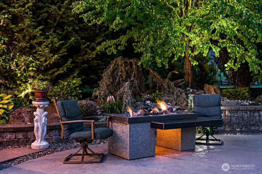 21713 45th Avenue Southeast Bothell, WA 98021 - Photo 29 of 40 a view of a chairs and table in a backyard