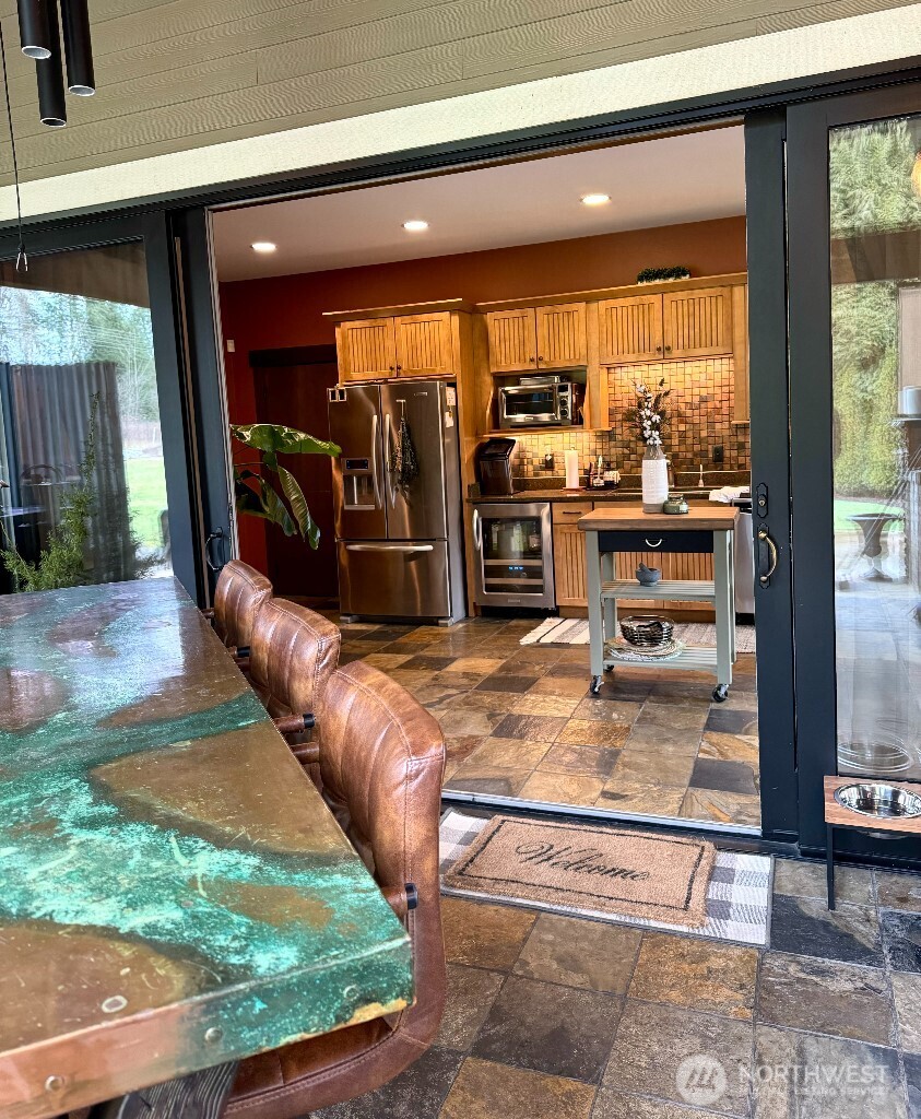21713 45th Avenue Southeast Bothell, WA 98021 - Photo 30 of 40 a room with furniture and a floor to ceiling window