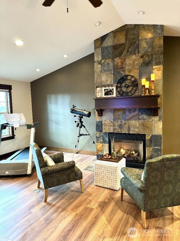 21713 45th Avenue Southeast Bothell, WA 98021 - Photo 34 of 40 a living room with furniture and a fireplace