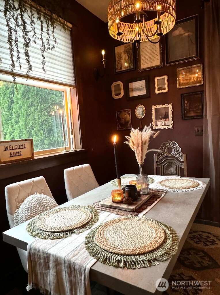 21713 45th Avenue Southeast Bothell, WA 98021 - Photo 35 of 40 a view of a dining room with furniture and chandelier