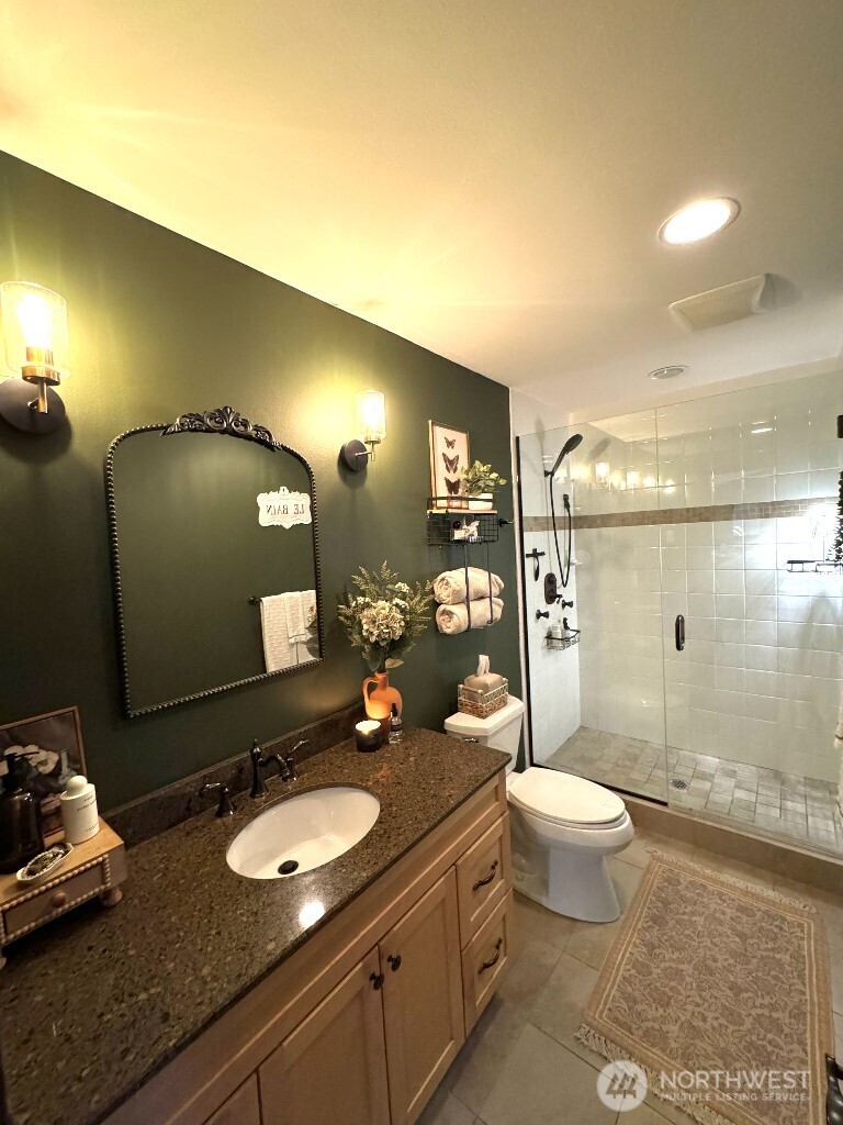 21713 45th Avenue Southeast Bothell, WA 98021 - Photo 38 of 40 a bathroom with a granite countertop sink toilet and shower