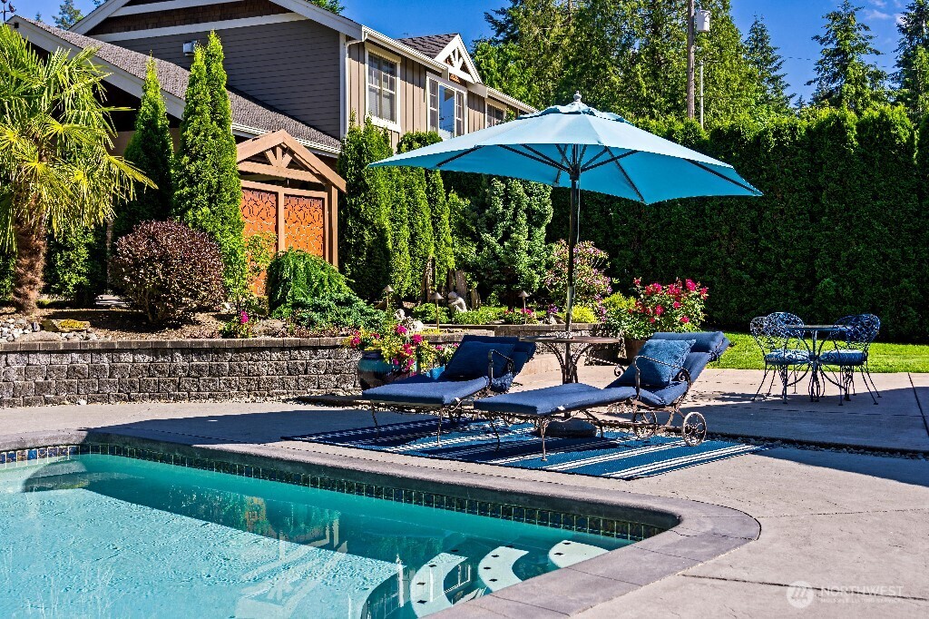 21713 45th Avenue Southeast Bothell, WA 98021 - Photo 4 of 40 a view of a chairs and table in backyard