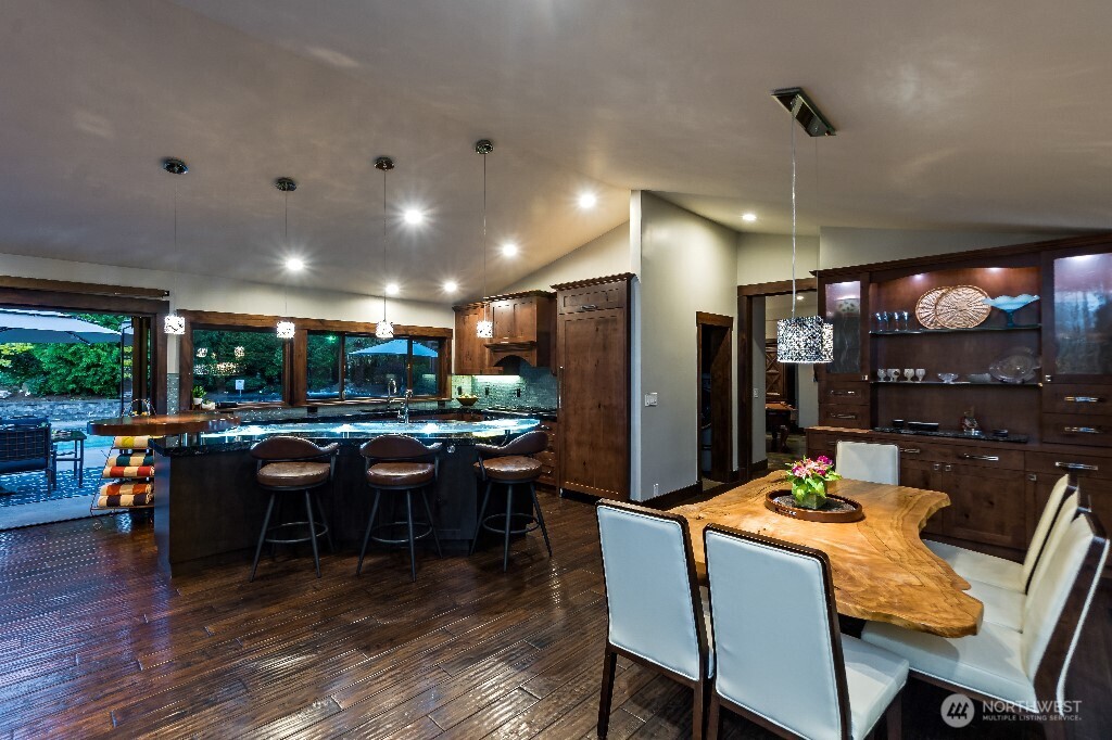 21713 45th Avenue Southeast Bothell, WA 98021 - Photo 10 of 40 a view of a dining room with furniture window and wooden floor
