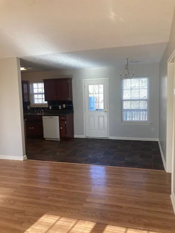 a kitchen with a stove cabinets and a sink