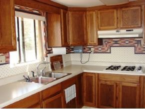 1810 Rocky Road Prescott, AZ 86305 - Photo 6 of 12 a kitchen with stainless steel appliances a sink stove and cabinets