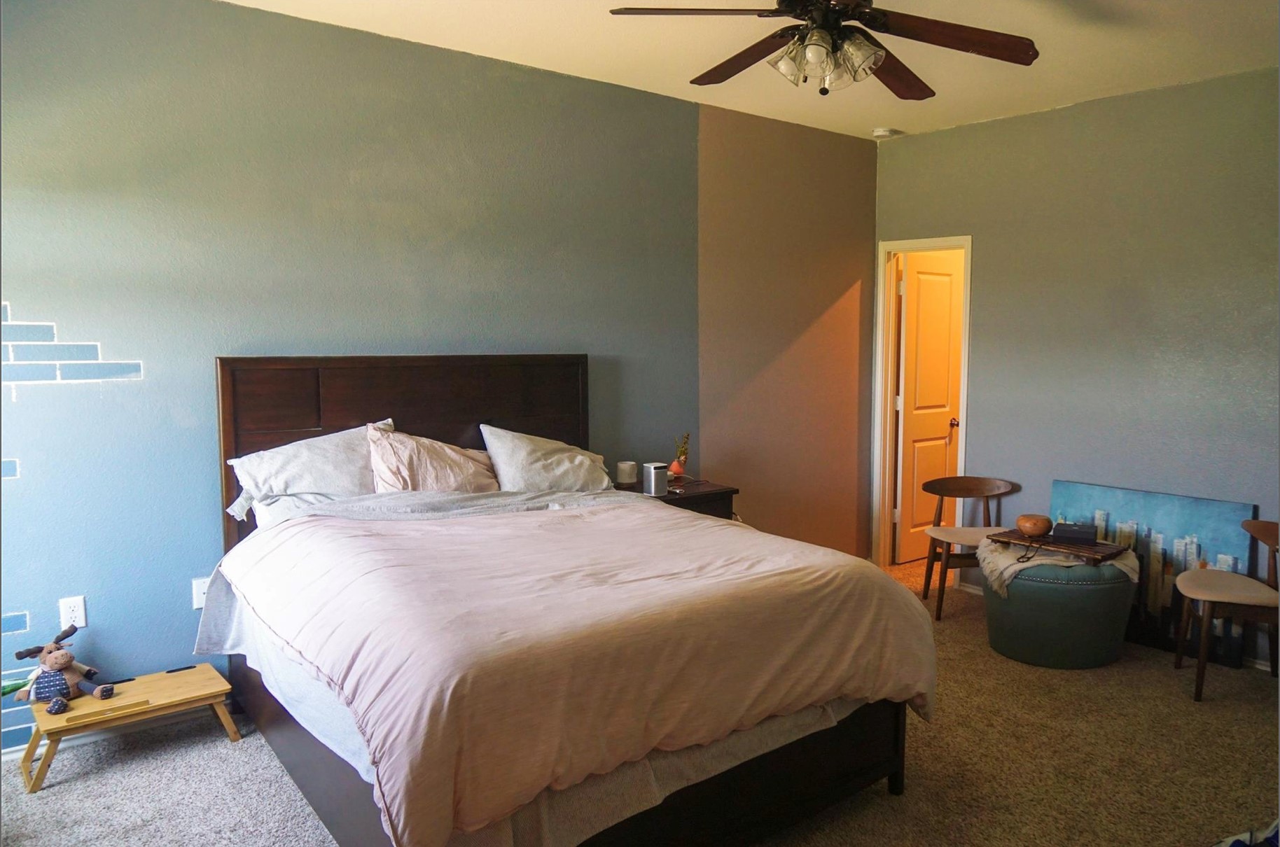 2321 Forgetmenot Lane Manor, TX 78653 - Photo 14 of 27 A well-lit bedroom featuring a dark wood bed frame and plush carpeting throughout.