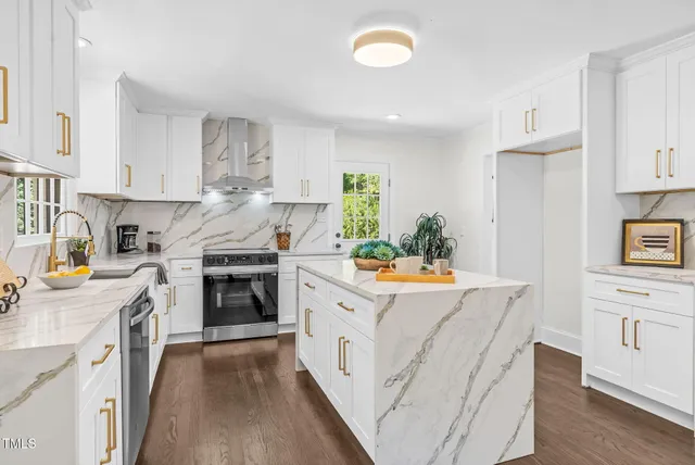 a kitchen with a stove top oven sink and cabinets