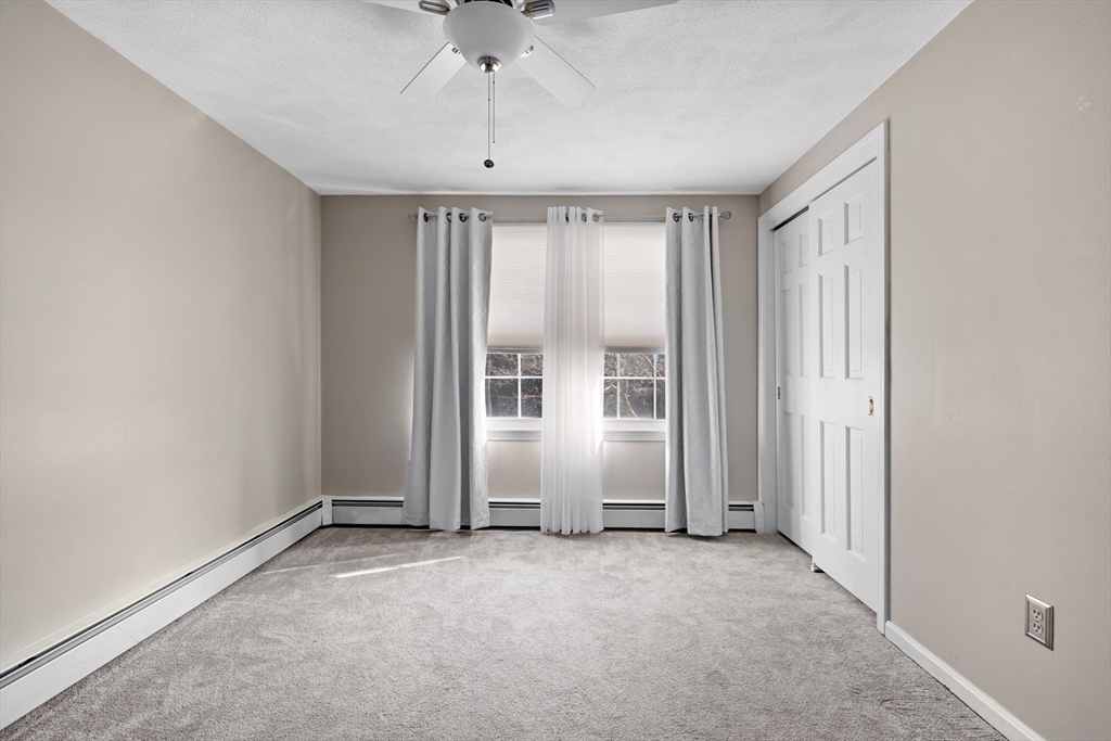 11 Clearview Road Stoneham, MA 02180 - Photo 18 of 42 an empty room with windows and closet
