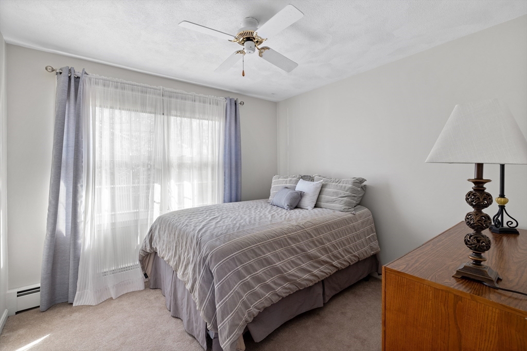 11 Clearview Road Stoneham, MA 02180 - Photo 19 of 42 a bedroom with a bed and a window
