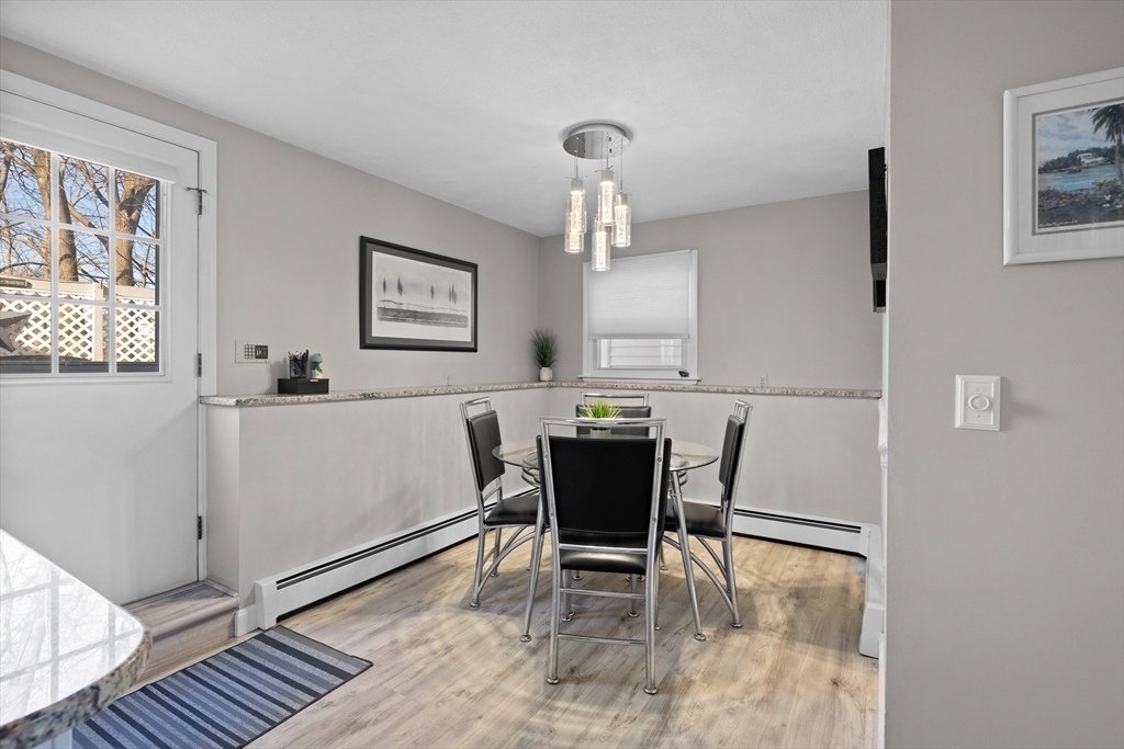 11 Clearview Road Stoneham, MA 02180 - Photo 25 of 42 a view of a dining room with furniture and wooden floor