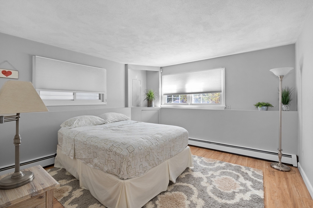 11 Clearview Road Stoneham, MA 02180 - Photo 28 of 42 a bedroom with a bed and window