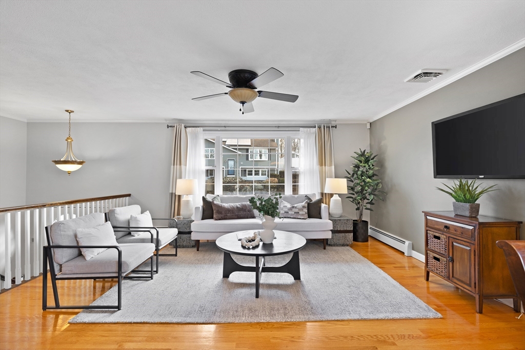 11 Clearview Road Stoneham, MA 02180 - Photo 3 of 42 a living room with furniture and a flat screen tv