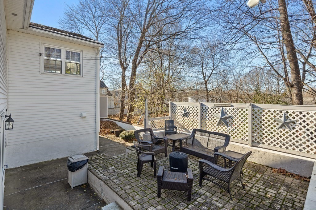 11 Clearview Road Stoneham, MA 02180 - Photo 38 of 42 a view of a chairs and table in backyard