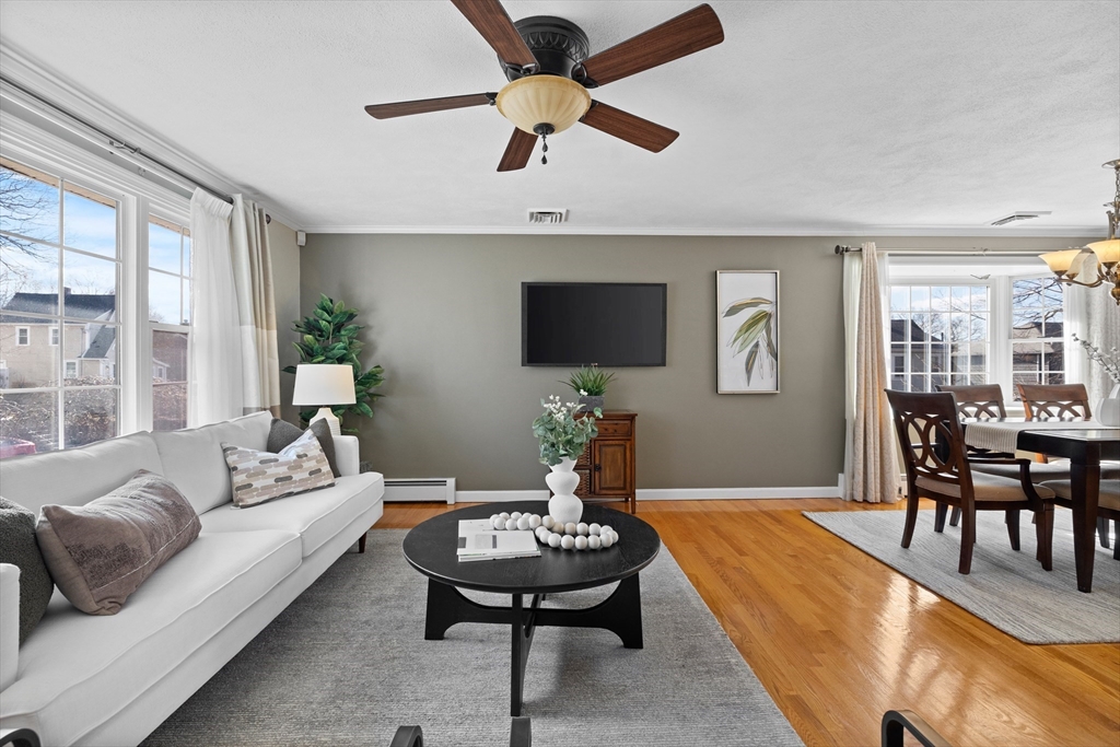 11 Clearview Road Stoneham, MA 02180 - Photo 5 of 42 a living room with furniture a rug and a flat screen tv