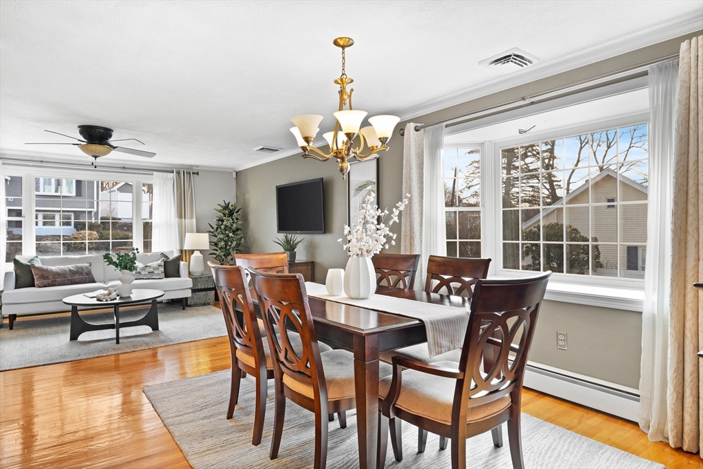 11 Clearview Road Stoneham, MA 02180 - Photo 9 of 42 a view of a dining room with furniture wooden floor and chandelier