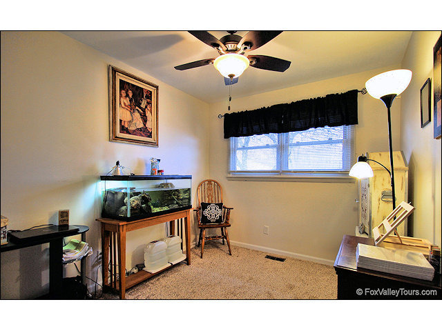 56 Sheffield Road Montgomery, IL 60538 - Photo 14 of 18 a living room with furniture and a flat screen tv