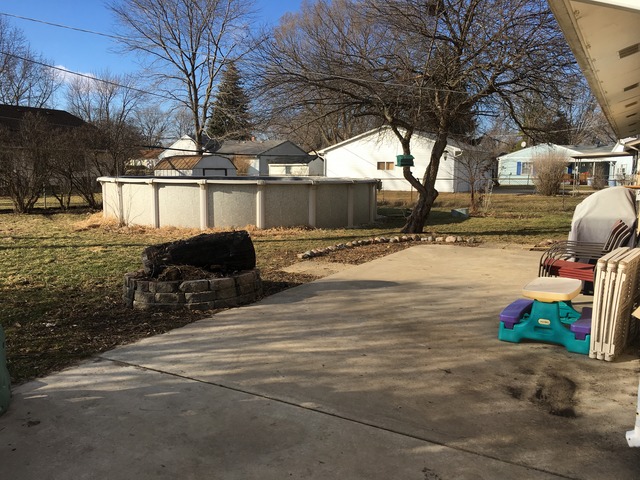 56 Sheffield Road Montgomery, IL 60538 - Photo 18 of 18 a view of a yard with car parked
