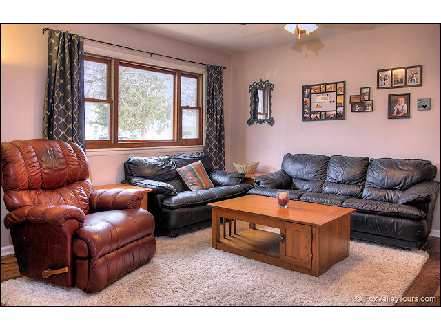 56 Sheffield Road Montgomery, IL 60538 - Photo 4 of 18 a living room with furniture and a large window