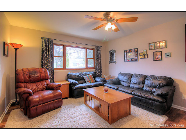 56 Sheffield Road Montgomery, IL 60538 - Photo 5 of 18 a living room with furniture a rug and a window