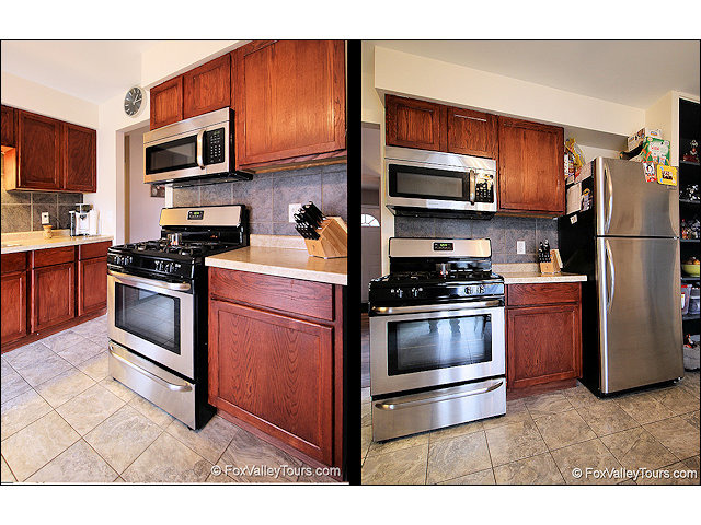 56 Sheffield Road Montgomery, IL 60538 - Photo 6 of 18 a kitchen with stainless steel appliances granite countertop a stove microwave and refrigerator