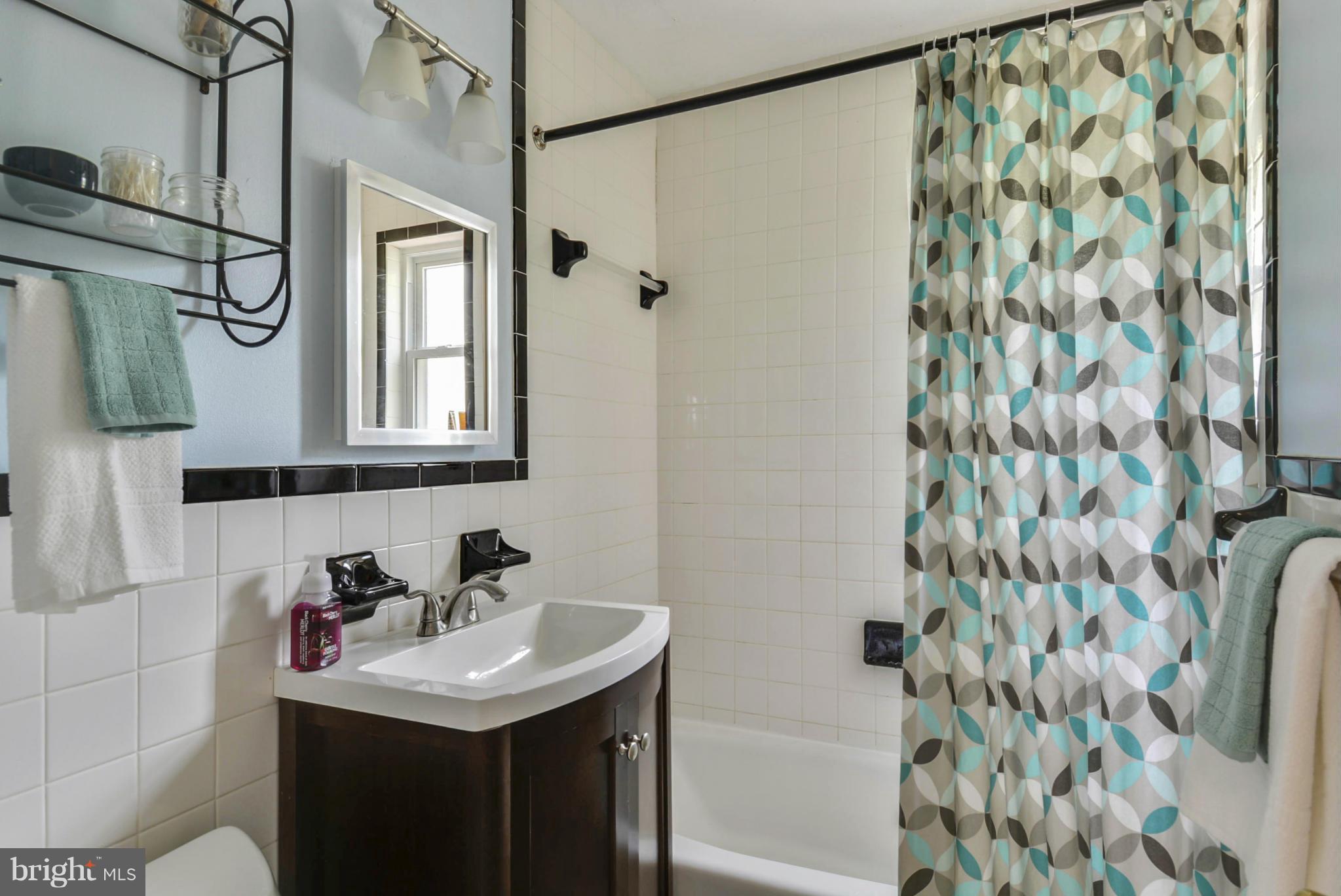 501 Royalton Road Silver Spring, MD 20901 - Photo 15 of 29 a bathroom with a sink toilet and shower
