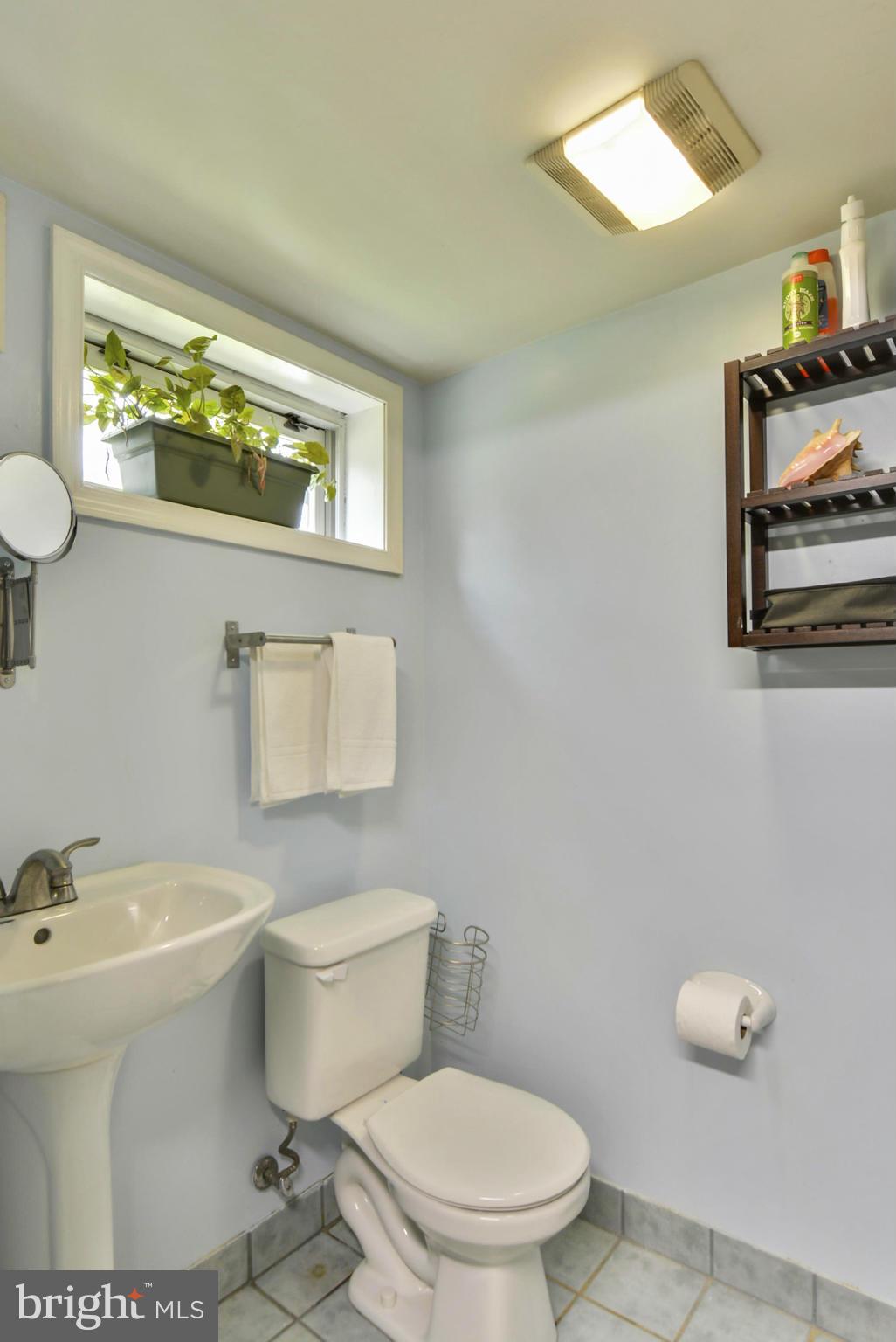 501 Royalton Road Silver Spring, MD 20901 - Photo 23 of 29 a white toilet sitting next to a bathroom sink