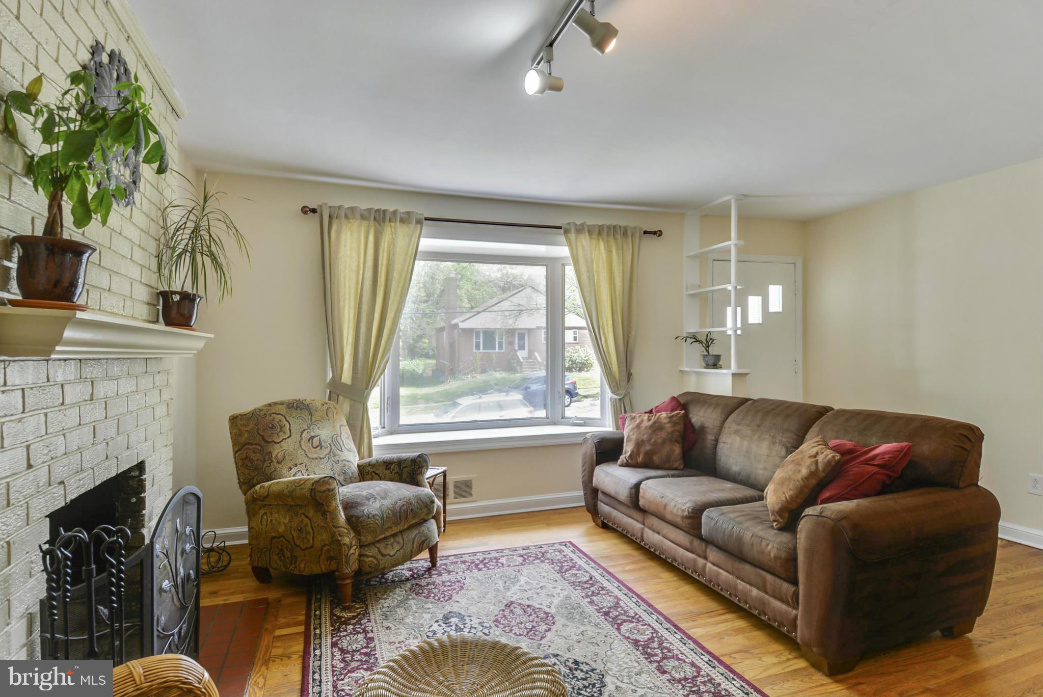 501 Royalton Road Silver Spring, MD 20901 - Photo 6 of 29 a living room with furniture and a fireplace