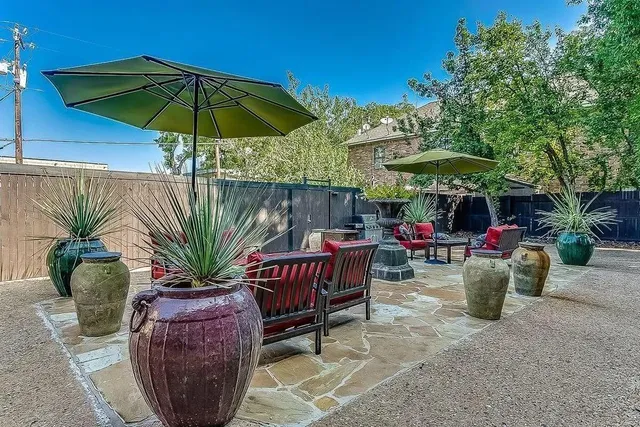 a view of a backyard with sitting area and furniture