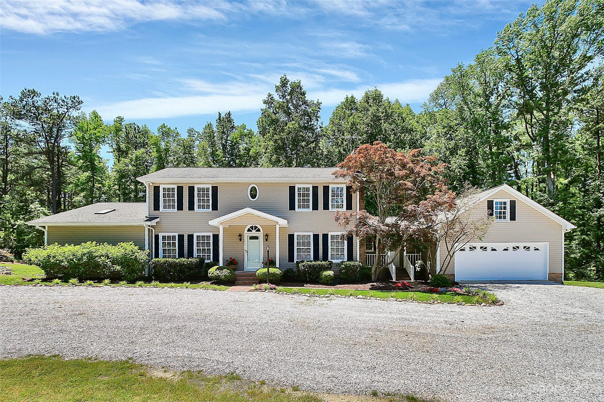 5218 Rehobeth Road Waxhaw, NC 28173 - Photo 1 of 35 a front view of a house with a yard and garage