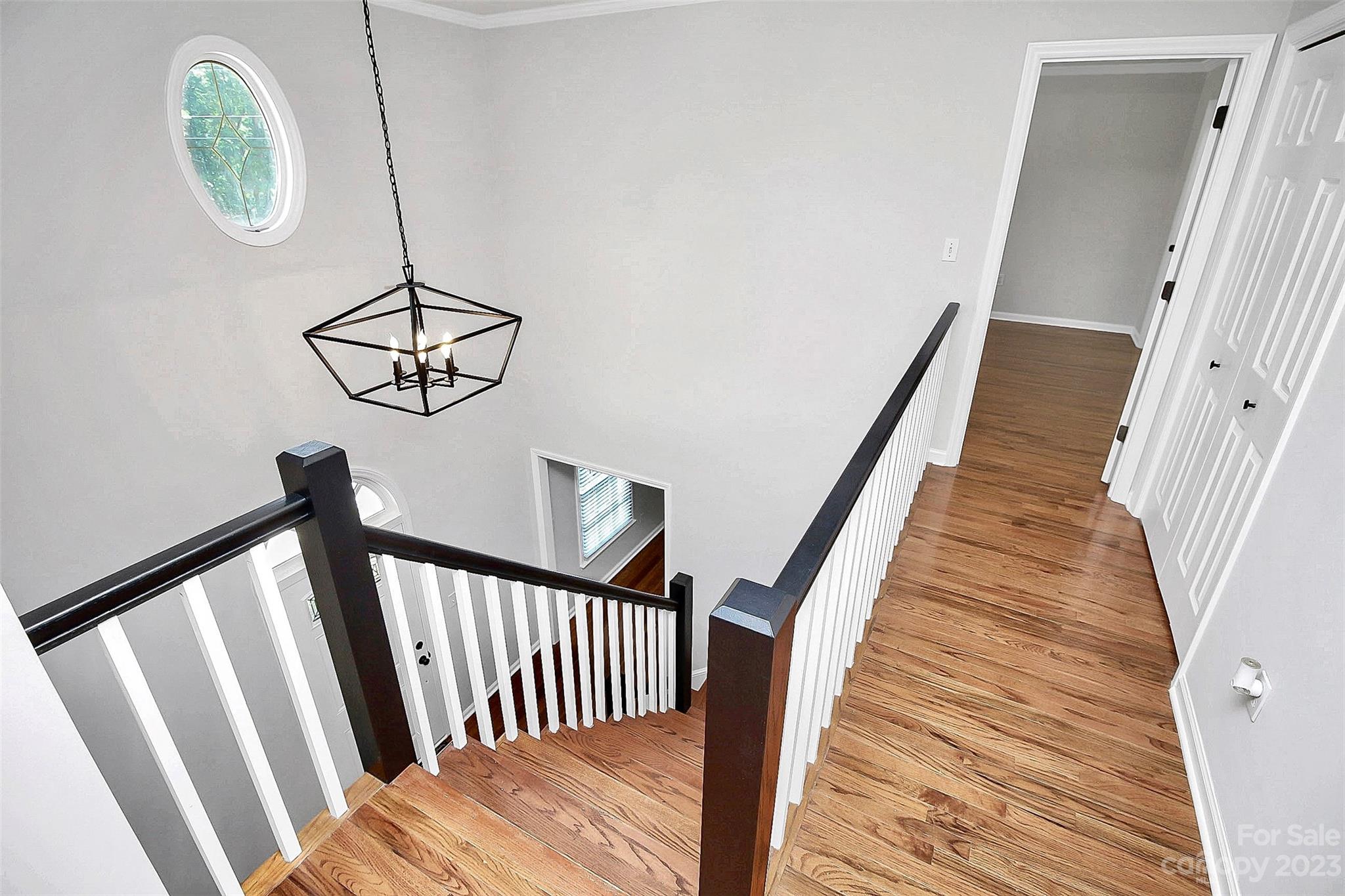5218 Rehobeth Road Waxhaw, NC 28173 - Photo 24 of 35 a view of staircase with wooden floor and fan