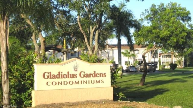 8162 Country Road, Unit 104 Fort Myers, FL 33919 - Photo 1 of 13 a sign on the side of a building