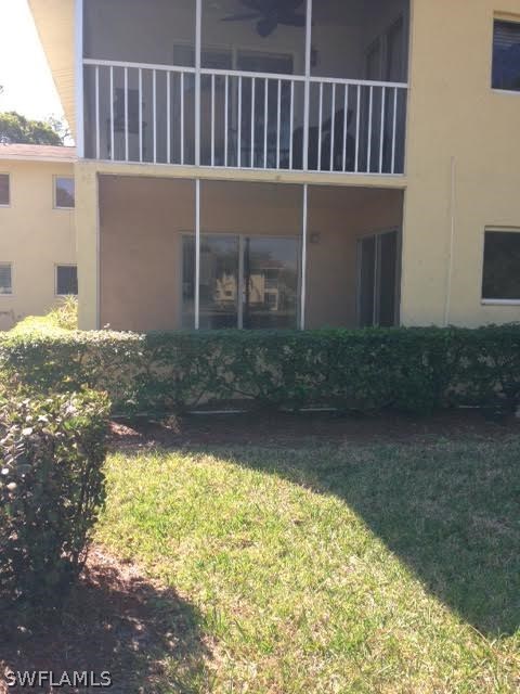 8162 Country Road, Unit 104 Fort Myers, FL 33919 - Photo 3 of 13 a view of a house with a yard