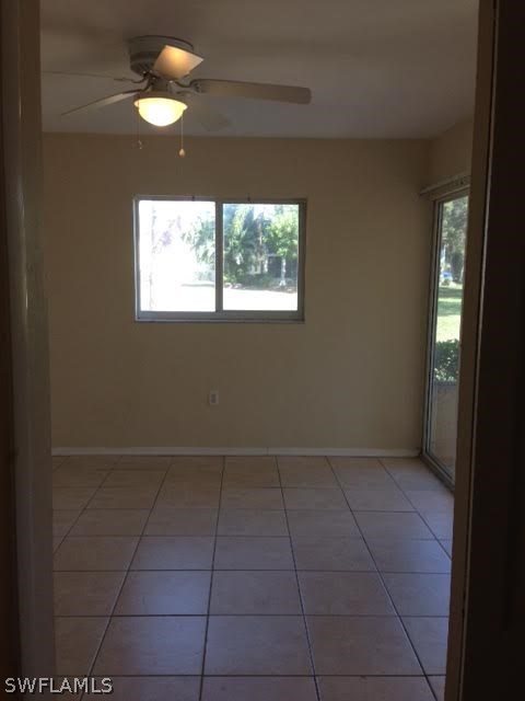 8162 Country Road, Unit 104 Fort Myers, FL 33919 - Photo 6 of 13 a view of an empty room with a window