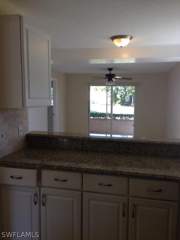 8162 Country Road, Unit 104 Fort Myers, FL 33919 - Photo 8 of 13 a kitchen with granite countertop white cabinets white appliances and a sink
