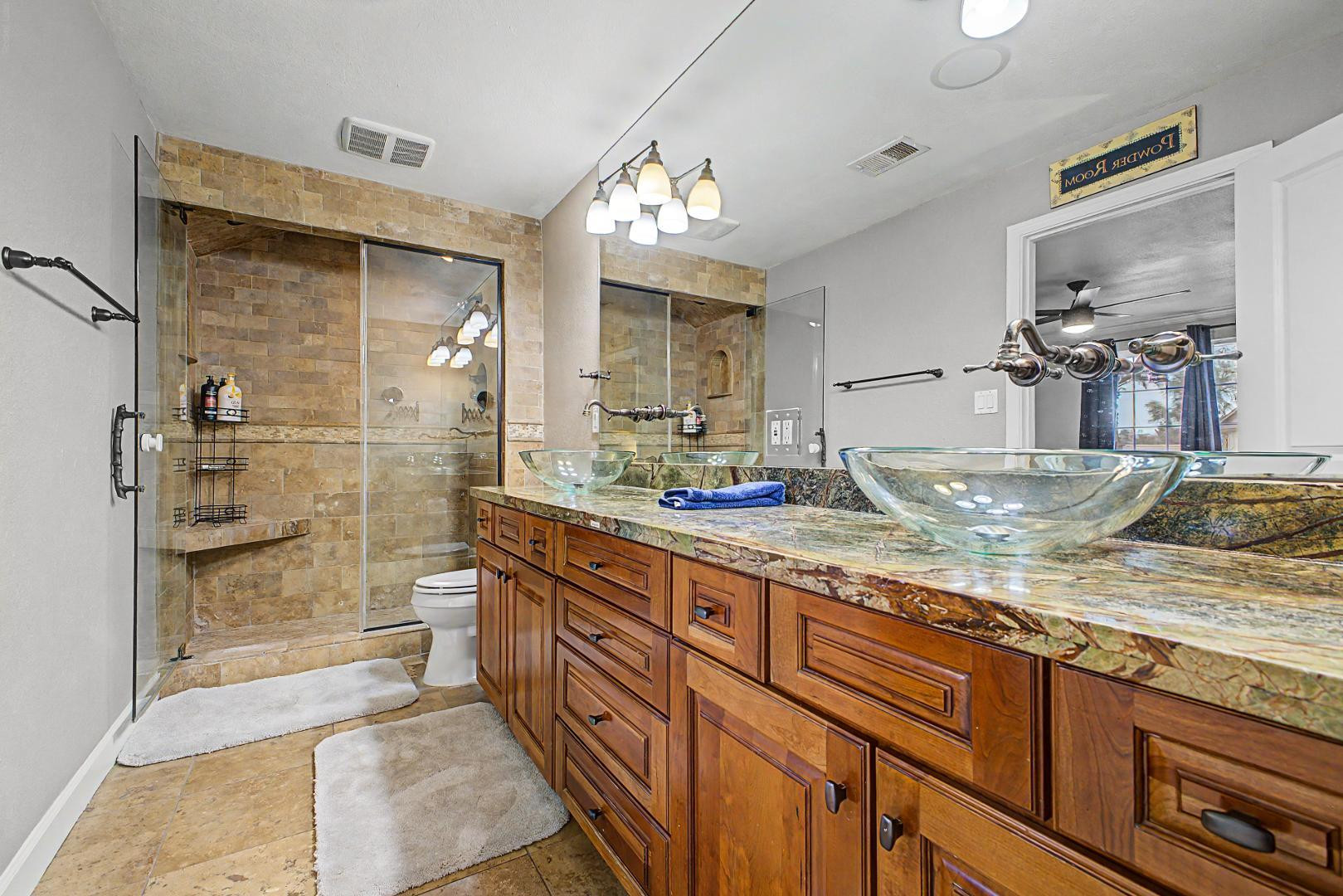 3346 East Cochise Road Phoenix, AZ 85028 - Photo 23 of 40 a bathroom with a granite countertop sink mirror and shower