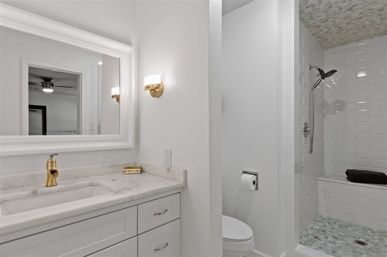 1911 Brierbrook Road Germantown, TN 38138 - Photo 23 of 26 a bathroom with a sink a toilet and shower